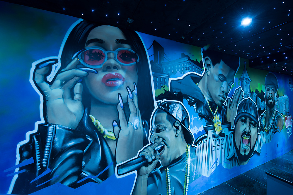 Inside Plug Studios NYC, the lounge and mural wall